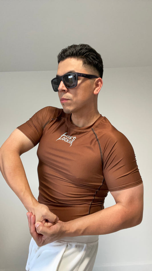 Vigilante Compression Shirt – Rich Brown w/ Icy Blue Logo (Short Sleeve) - Luis’s Locker